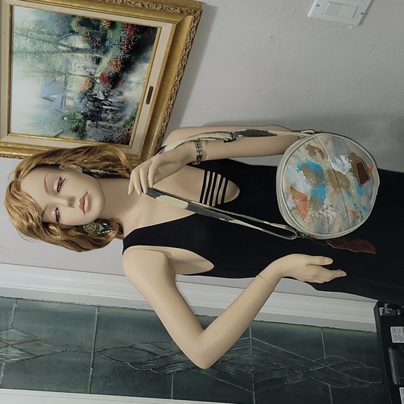 Canvas round crossbody purse. Has splashes of color. - Picture 6 of 10